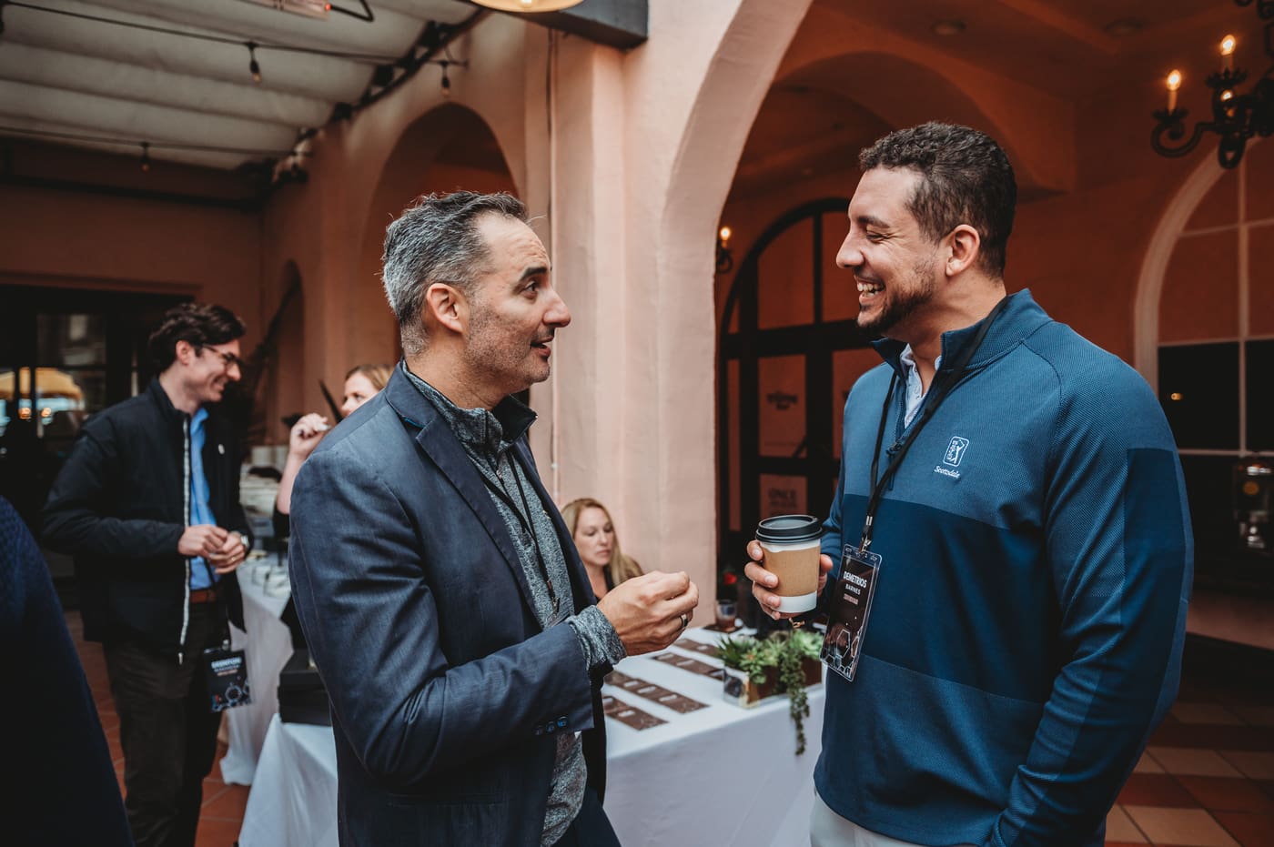 Two FIRE Summit 2025 attendees in conversation at La Valencia