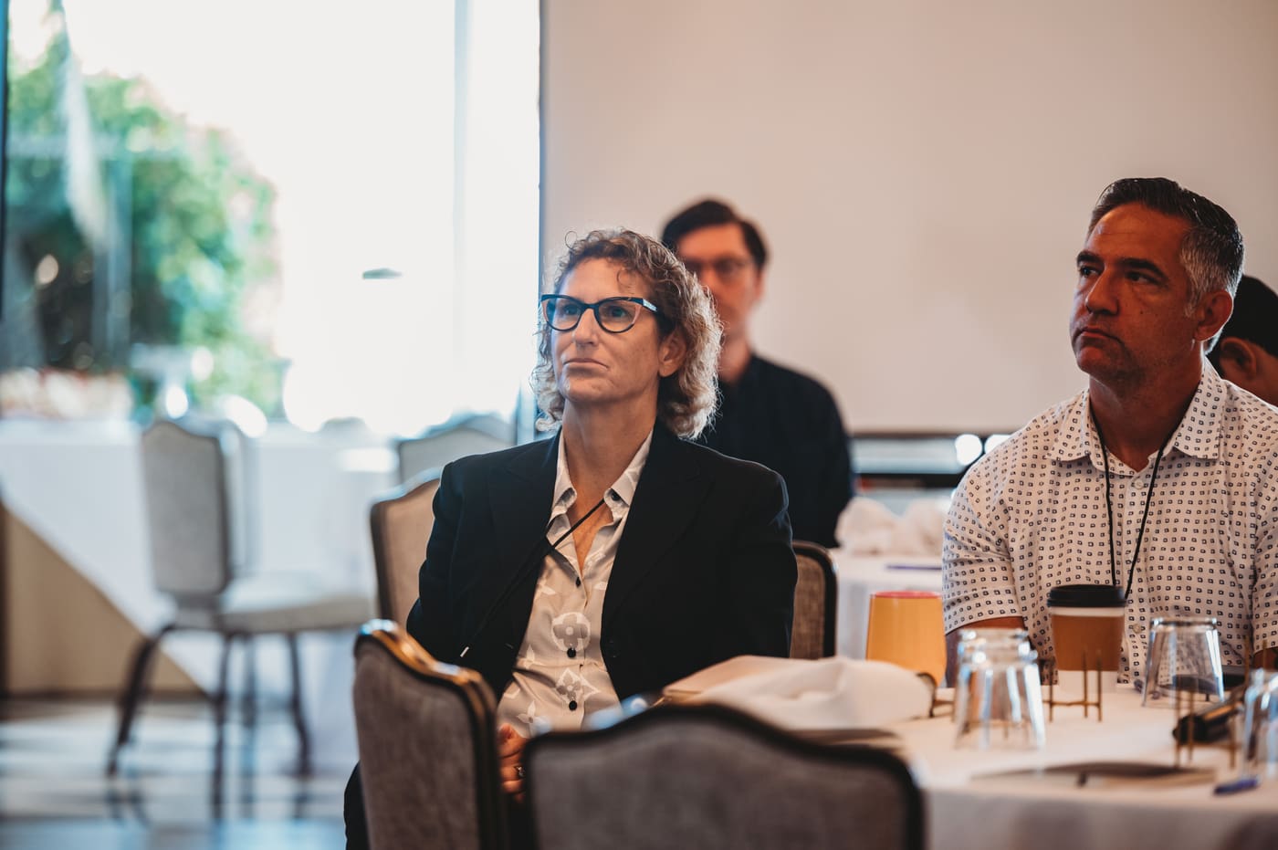 FIRE Summit 2025 attendees in a thoughtful discussion