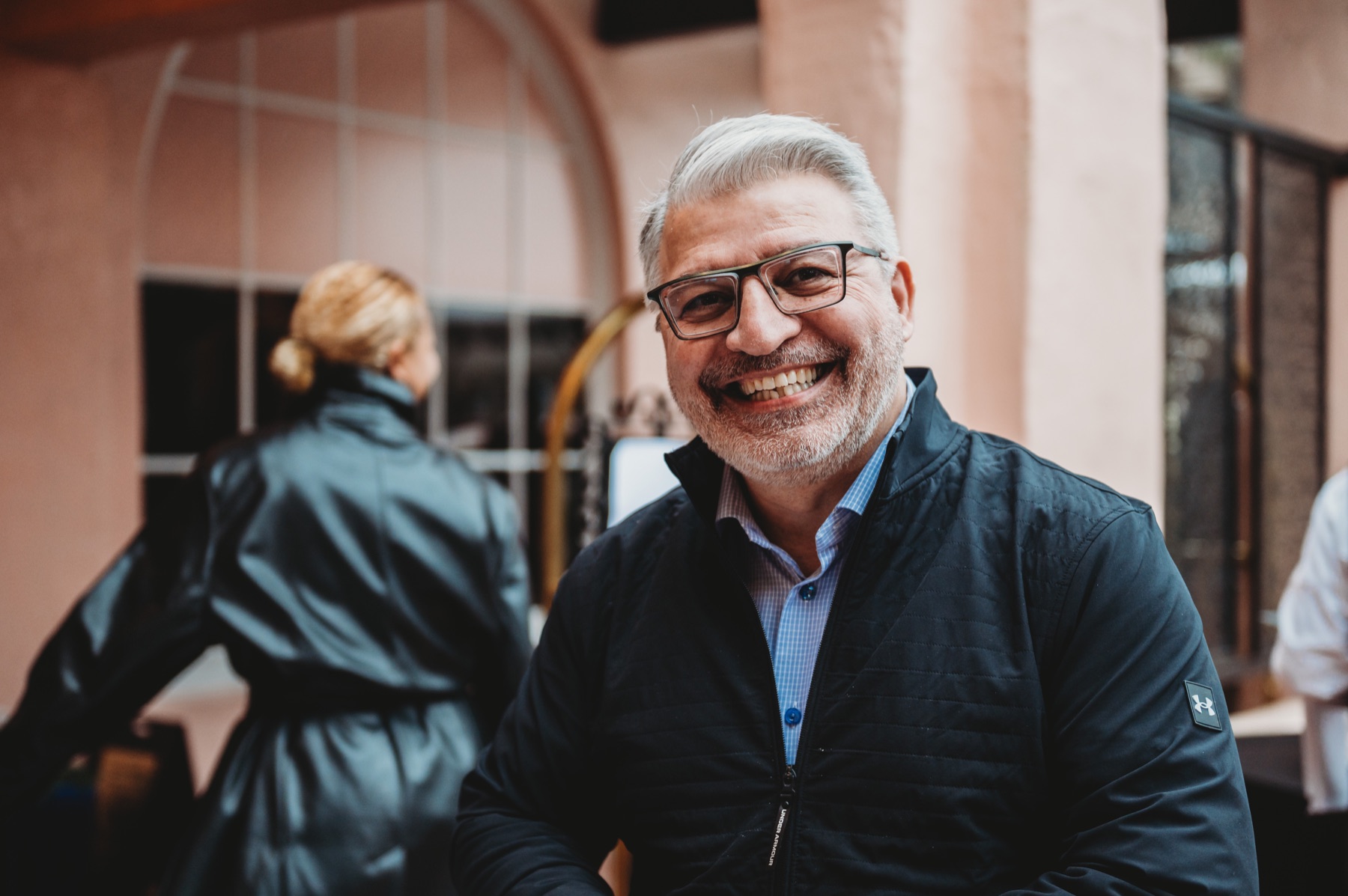 A smiling FIRE Summit 2025 attendee at La Valencia