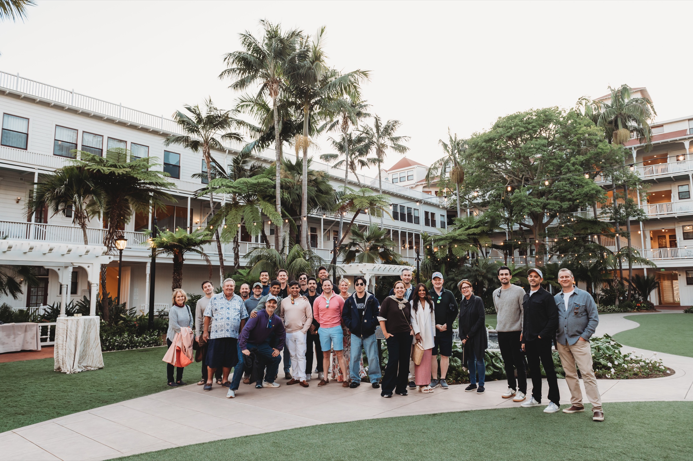 FIRE Summit 2026 attendees posing together in the La Valencia courtyard