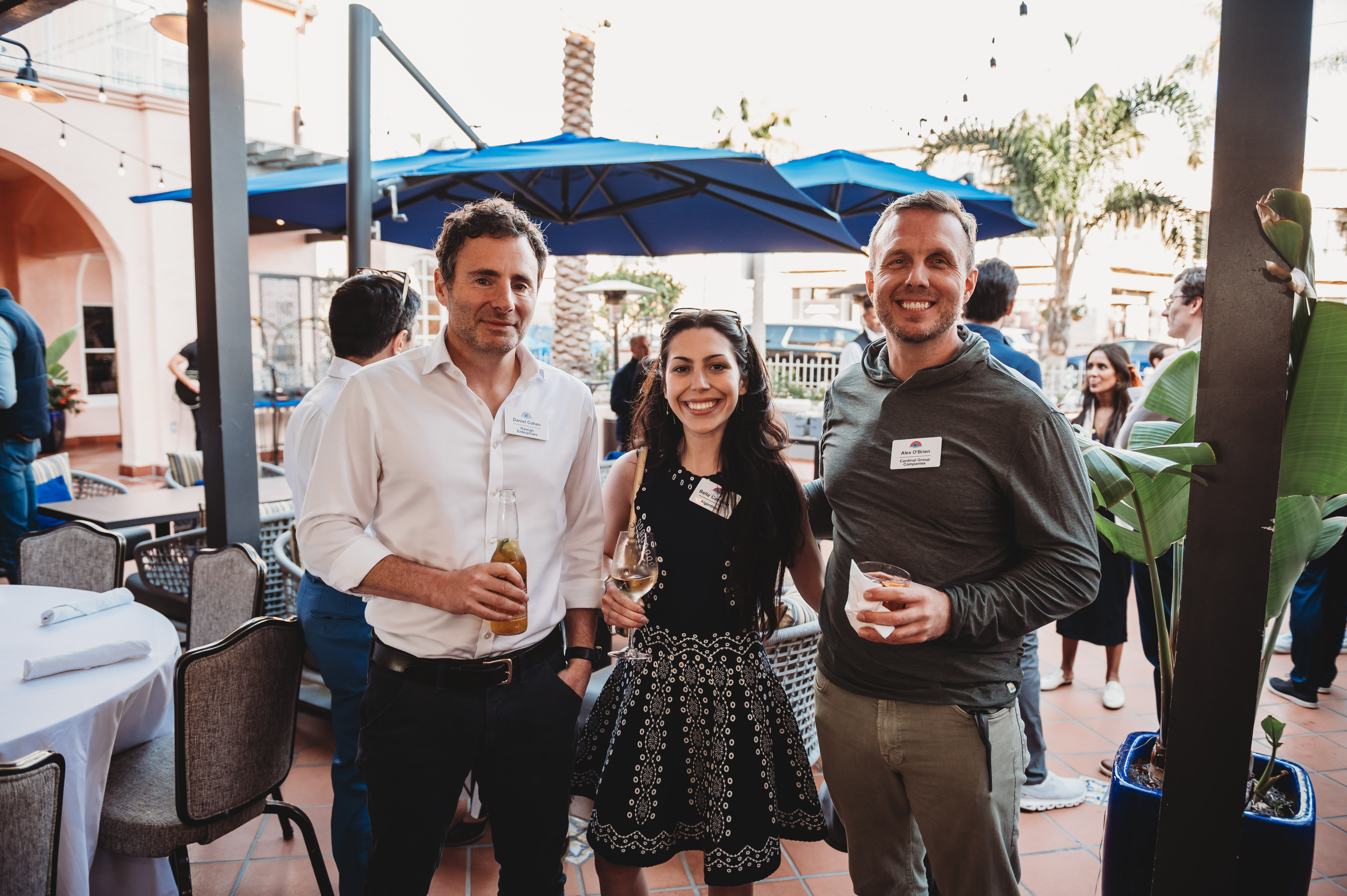 Three FIRE Summit 2026 attendees together at the terrace reception