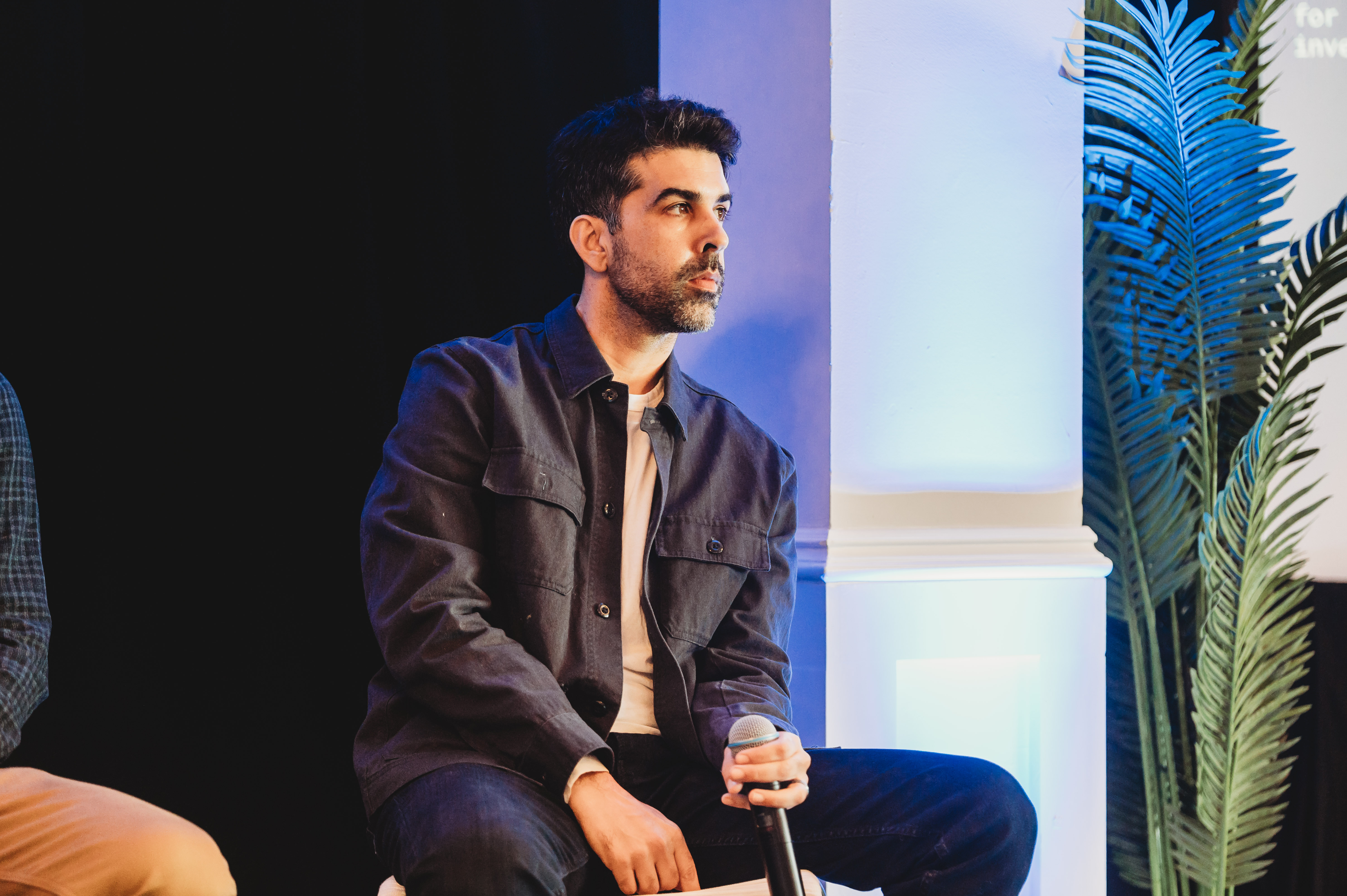 A FIRE Summit 2026 panelist listening onstage