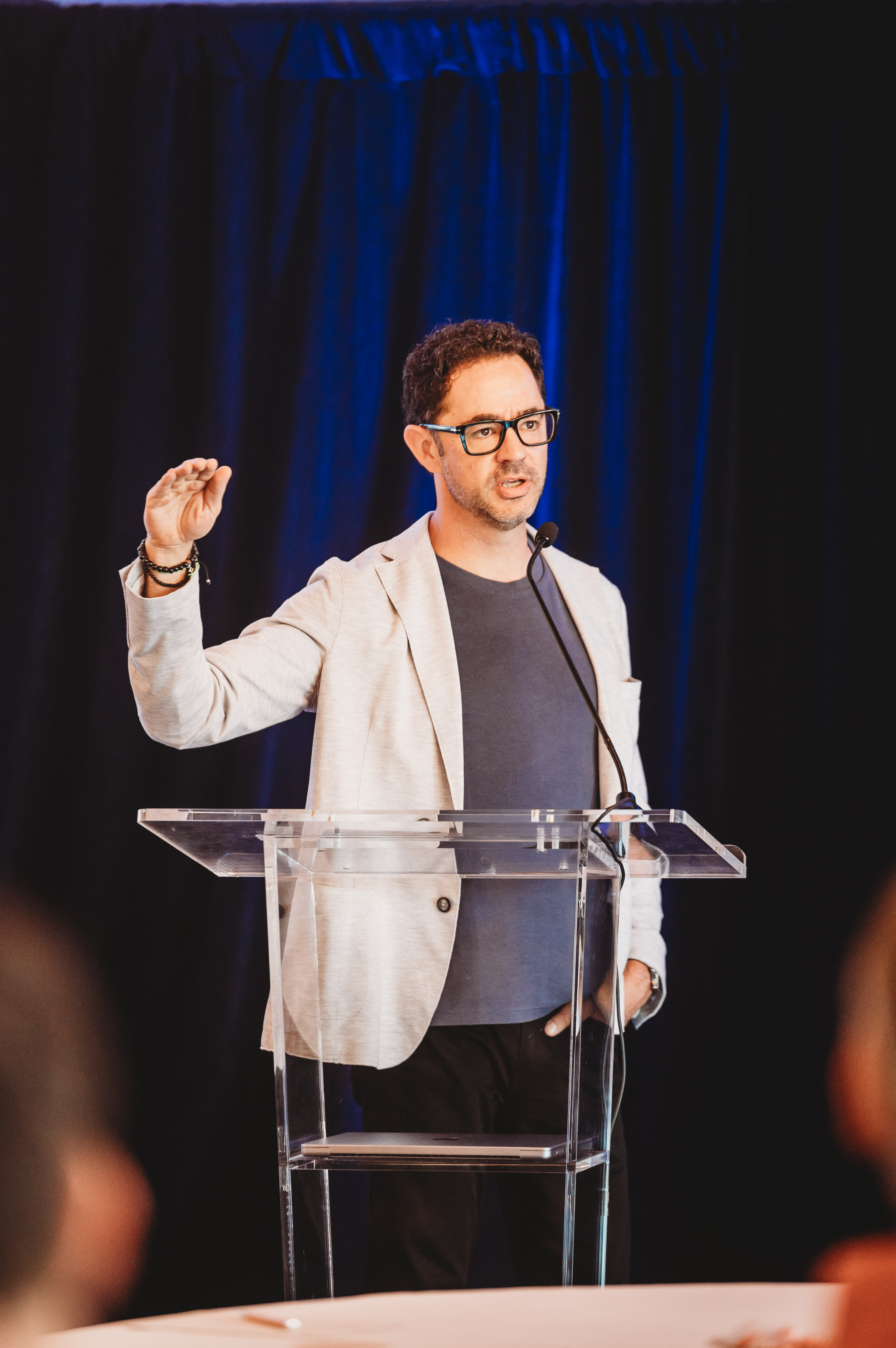 A FIRE Summit 2026 speaker presenting from the podium